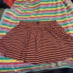 Pink and black striped skirt